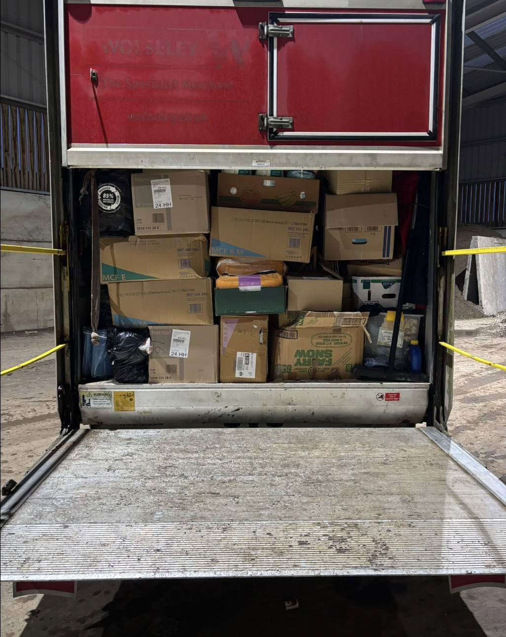 Van packed with cardboard boxes and household items during a waste clearance
