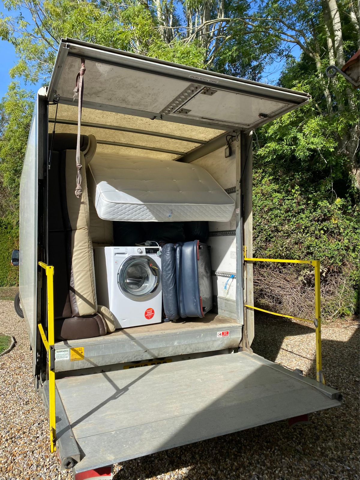 Van loaded with a washing machine and furniture for a house removal
