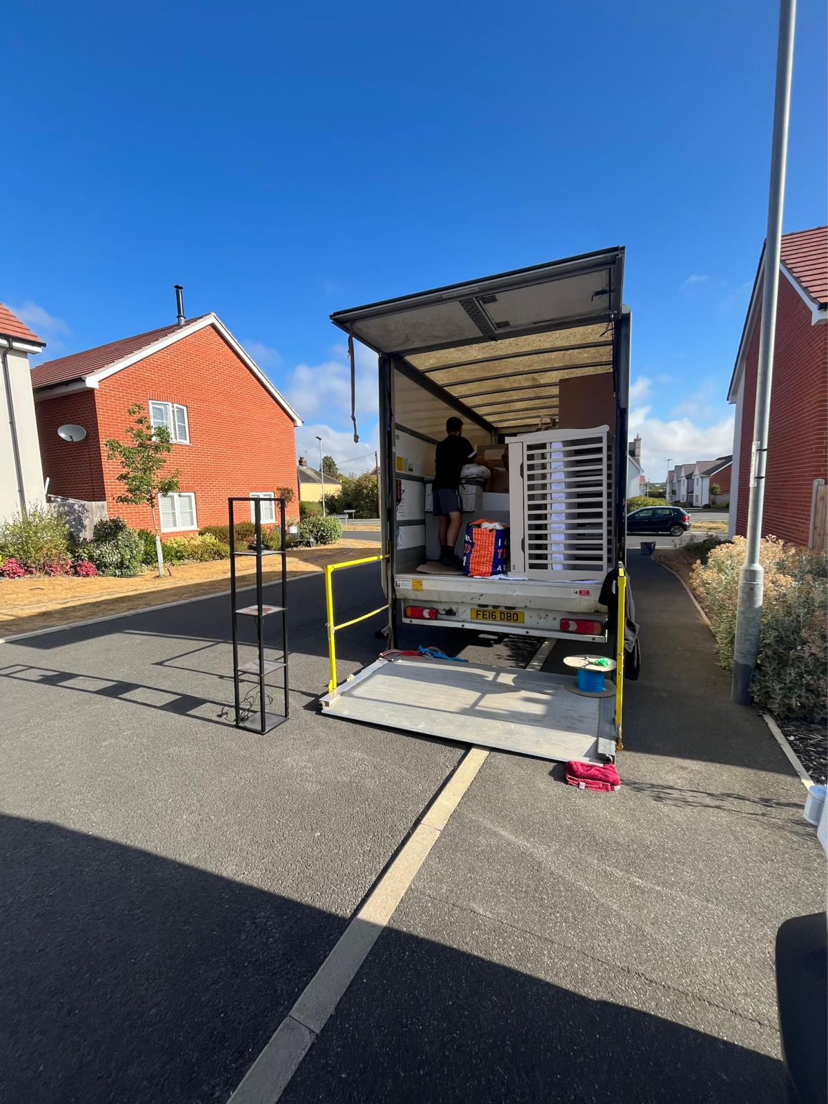 Man loading furniture into the back of our removals van